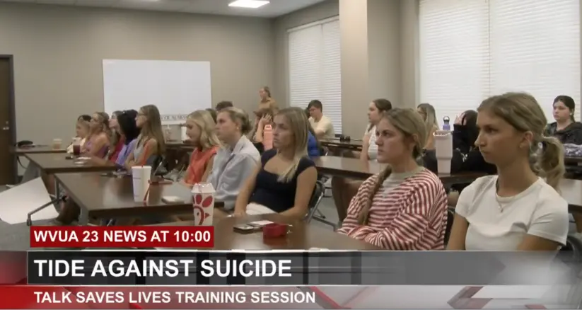 Students in Talk Saves Lives training with text overlay: WVUA 23 News at 10, Tide Against Suicide